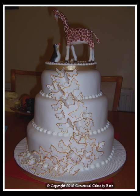 Three tier stacked gilded butterflies cake