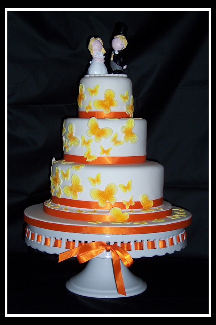 Three tier stacked round butterfly wedding cake