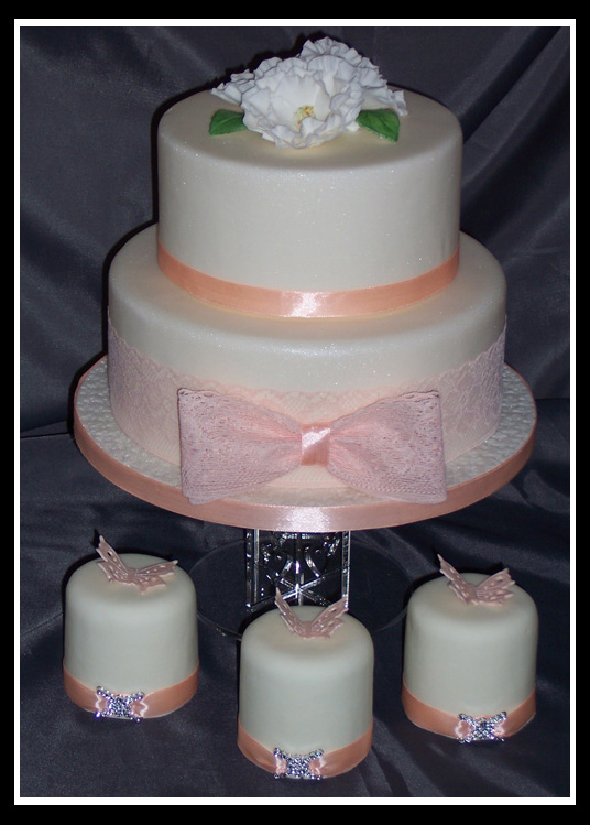 peach and ivory two tier staked wedding cake