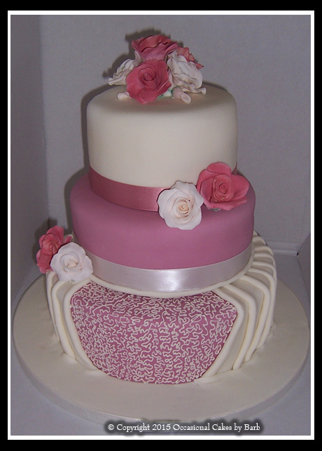 Three tier round stacked dusky pink and ivory cake
