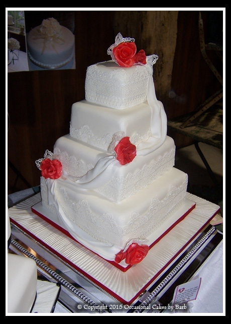 Four tier stacked square wedding cake
