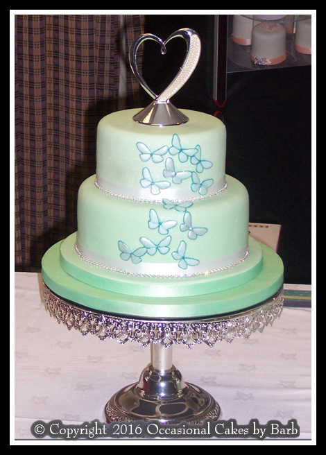 Mint green butterflies wedding cake