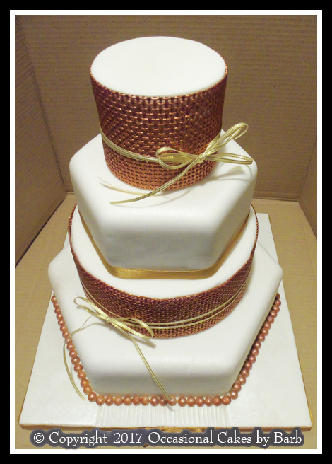 Four tier mixed round and hexagonal stacked wedding cake