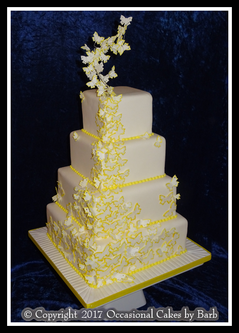 Vibrant yellow butterfly wedding cake