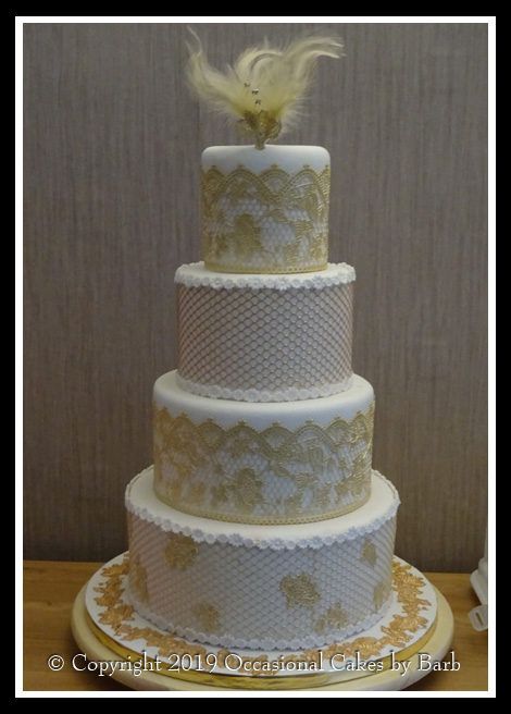 Four tier round with gold edible lace