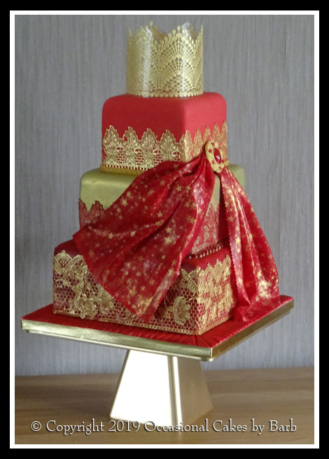 Vibrant red and gold wedding cake