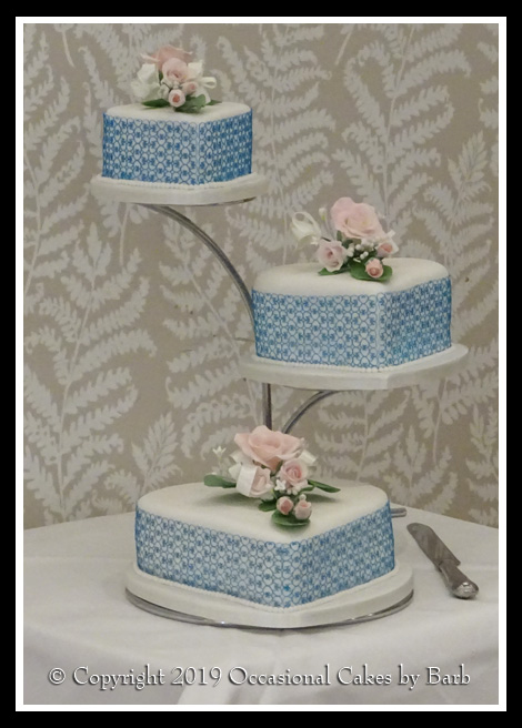 heart wedding cake with teal lace