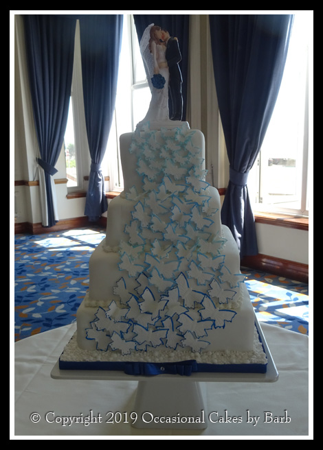 Vibrant blue butterfly wedding cake
