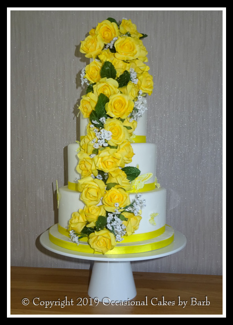 Round four tier weding cake with foam roses